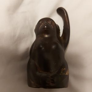 Brass bell- a monkey  its dark bc it has not been shined, but makes look natural